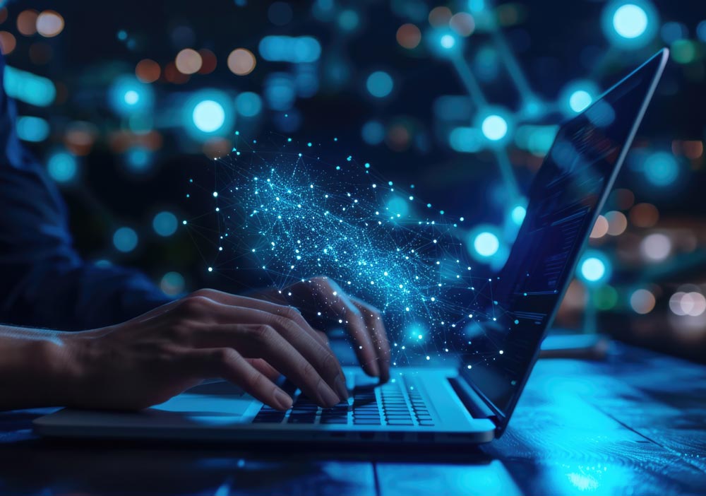 Hands typing on laptop with digital network graphic